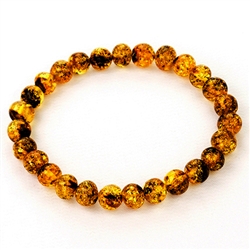 Beautifully shaped round amber beads speckled with lots of inclusions.
Elastic makes it easy to put on and take off. Interior diameter is approx 2.25" before stretch. Bead diameter is approx .3".