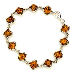 12 square amber beads each set in a sterling silver frame. 7" - 18cm long.
