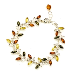 Three colors of amber set in silver shaped to form a trail of leaves in this lovely bracelet 7.5: long and adjustable to shorten.