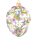 Artfully hand-crafted in Poland, this gorgeous clear glass egg is embellished with fabric, beads, and glitter in a pink and purple flower motif. Elegant and colorful, this glass egg ornament with pink and purple flowers will make a stunning keepsake for