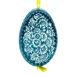 This beautifully designed goose egg is dyed one color and the design scratched into the egg using a sharp knife. The technique is called "skrobanki" in Polish. The eggs have been emptied and strung through with ribbon for hanging.