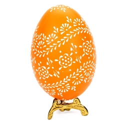 This beautifully designed egg is dyed one color then white wax is melted and applied to form an intricate design which is left on the surface. The egg is emptied. Stand not included.