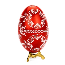 This beautifully designed egg is dyed one color then white wax is melted and applied to form an intricate design which is left on the surface. The egg is emptied. Stand not included.