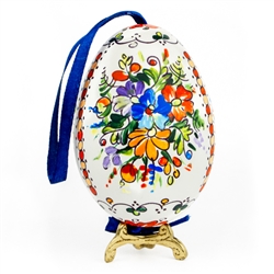 This beautifully designed goose is completely hand painted. The painting is done in a traditional style from Opole. Ready to hang. Eggs are blown and can last for generations. 
Stand sold separately.