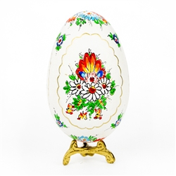 This beautifully designed goose egg is hand painted by master folk artist Alina Wypchlo from Opole, Poland. Her colors are strong and bright. Look carefully and you will find humorous folk elements of nature incorporated into her designs (i.e. a cricket