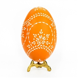 This beautifully designed egg is dyed one color (dark green) then white wax is melted and applied to form an intricate design which is left on the surface. The egg is emptied. Stand not included.