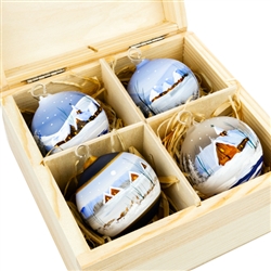 Hand painted glass ornaments featuring Polish country scenes in a deluxe painted wooden box. Hand made so no two ornaments or boxes are exactly the same. Ornaments are approx 2.25" in diameter.