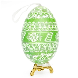 This beautifully designed egg is dyed one color, then white wax is melted and applied to form an intricate design which is left on the surfce. The egg is emptied and strung with ribbon for hanging or you can remove the ribbon.  This is the work of master