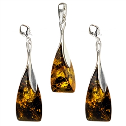 Artistically shaped amber and silver earrings and pendant set.  Approx 1.5" long.
