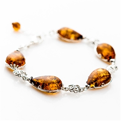 7 spheres of amber each set with sparkling sterling. 7" to 8" adjustable.