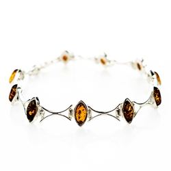 10 marquis shaped amber beads each set in a sparkling sterling silver frame. 7.5" long.