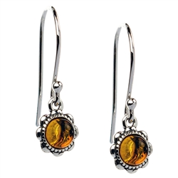 Delicate circles of Baltic amber suspended from sterling silver French hooks. Size approx .75" x .25".