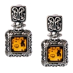 Gorgeous Baltic Amber square stud earrings surrounded with a ring of antique style sterling silver. Size approx .75 x .4".