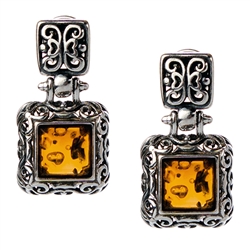 Gorgeous Baltic Amber square stud earrings surrounded with a ring of antique style sterling silver. Size approx .75 x .4".