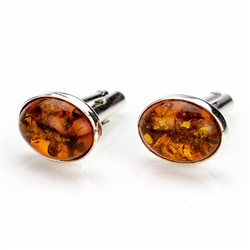 Beautiful pair of oval shaped silver cuff links highlighted with oval amber centers.
Size approx .6" x .3"