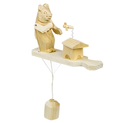 Wooden spin toy from Russia that will bring smiles to all who try it! This bear is preparing for a tasty treat of honey!  A perfect example of an old fashioned action toy. Hand made traditionally by parents and grandparents for their children. a wonderful