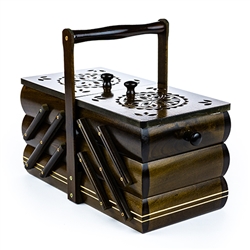 Polish sewing box with expandable pull-out drawers. Hand carved circular design on the top lids. Handle is removed for shipping.