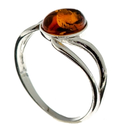 Petite size honey oval amber set in sterling silver.