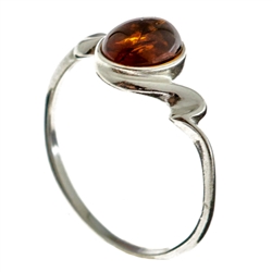 Petite size honey oval amber set in sterling silver.