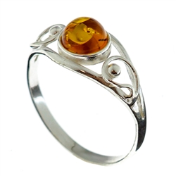 Petite size honey round amber set in sterling silver.