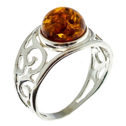 Petite size round honey amber set in sterling silver.