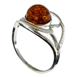 Petite size honey round amber set in sterling silver.