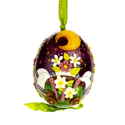This beautifully designed chicken egg is hand painted and decorated. The figures are made from dried salt that is applied to the egg, formed, dried and finally painted. A  little work of art!