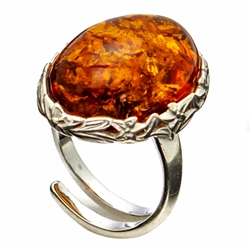 Oval Honey Amber Adjustable Ring set in sterling silver.