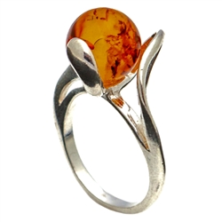 Petite size honey round amber set in sterling silver.