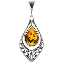 Sterling Silver with filigree detail surrounding a beautiful honey amber cabochon. 
Size is approx 1.75" x .75".
