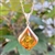 Sterling Silver with antique detail framing a beautiful honey amber cabochon.  Amber cabochon is approx  .75" x .75".