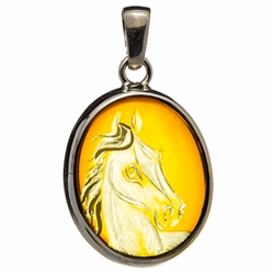 Beautiful oval shaped sterling silver amber cameo locket. The cameo is hand carved from the back of the pendant. Nicely detailed. Size is approx 1.25" x .75".