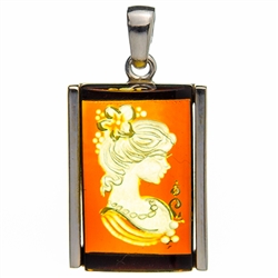 Beautiful rectangular shaped sterling silver amber cameo pendant. The cameo is hand carved from the back of the pendant. Nicely detailed. Size is approx 1.25" x .75".