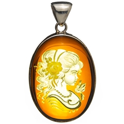 Beautiful oval shaped sterling silver amber cameo pendant. The cameo is hand carved from the back of the pendant.  Nicely detailed.  Size is approx  1.2" x 2".