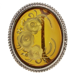 Beautiful oval shaped sterling silver amber cameo brooch. The cameo is hand carved from the back of the pendant. Nicely detailed. Size is approx 1.25" x 1".