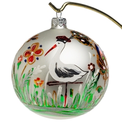 Celebrate your unique heritage with this distinctive ornament depicting Poland's favorite seasonal visitor...the stork. Our stork is wearing a Krakowiak hat and is surrounded by beautiful folk flowers. This unique ornament makes a great gift for friends a