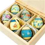 Hand painted duck eggs featuring Polish floral patterns and nested inside a hand painted wooden box. The duck eggs are blown out and come with a ribbon hanger.