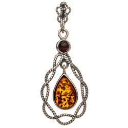 Sterling Silver with filigree detail surrounding a beautiful honey amber cabochon. 
Size is approx 1.5" x .7".