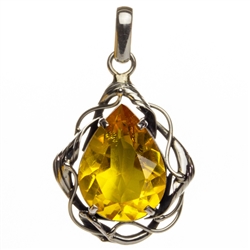 Light honey color amber cabochon set in an artistic sterling silver frame.  Size is approx 2" x 1.25".