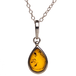 Sterling Silver framing a beautiful honey amber cabochon drop.   Cabochon size is approx. .5" x .4".