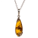 Sterling Silver with antique detail highlighting a beautiful honey amber cabochon.  Amber cabochon size is 1" x .5".