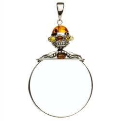 Unique and beautifully hand-crafted sterling silver magnifying glass decorated with amber highlights. Has its own silver finding which can be used to attach a chain if desired. Size is approx 3.25" x 2".