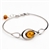 This sterling silver bracelet features a gorgeous center of honey amber.  Size is 7" with a 1" extender.