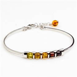 This sterling silver bracelet features an array of amber from light to dark.  This is a 7" bracelet with a 1" extender.