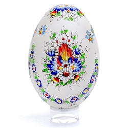 This beautifully designed goose egg is hand painted by master folk artist Alina Wypchlo from Opole, Poland. Her colors are strong and bright. Look carefully and you will find humorous folk elements of nature incorporated into her designs (i.e. a cricket