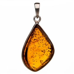 Sterling Silver framing a beautiful honey amber cabochon. Size is approx 1.5" x .75".