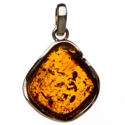 Sterling Silver framing a beautiful honey amber cabochon.  Size is approx. 1.25" x 1".