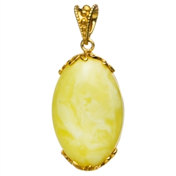 Beautiful custard amber cabochon framed in antique style gold vermeil. Size is approx 1.5" x .75" x .25".