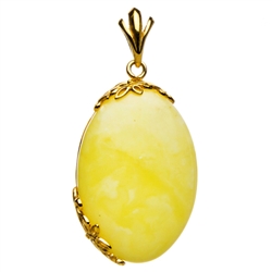 Beautiful custard amber cabochon framed in antique style gold vermeil.  Size is approx 1.75" x .8" x .25".