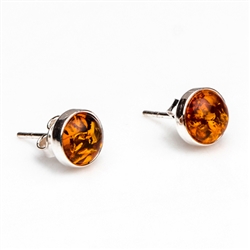 Gorgeous Baltic Amber round stud earrings framed in sterling silver.